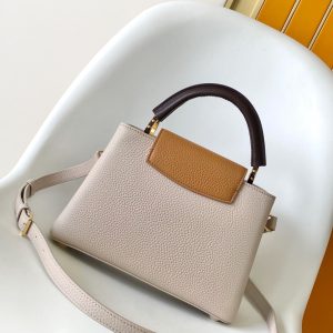 Alternative view of p115031.05 x 20.0 x 11.0 cm (L x H x W) 27.0 x 17.3 x 9.0 cm (L x H x W) 21.0 x 13.6 x 8.0 cm (L x H x W) • Taurillon calf leather • Calf leather trim •Cowhide leather lining•Metal hardware•Flap can be positioned inside or outside•Zippered interior pocket•Interior slip pocket•Metal studs•Holds smartphone, LV Vertical wallet, headphones, and keys•Strap: Detachable, adjustable•Strap half-length: 45.5 cm•Strap half-length adjustable to: 53.0 cm•Handle: Single handle